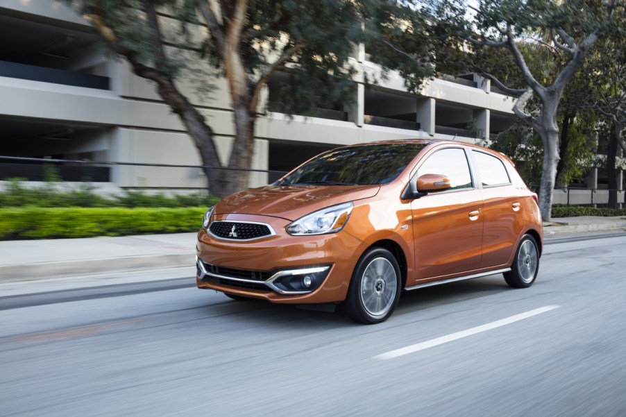 An orange 2019 Mitsubishi Mirage driving