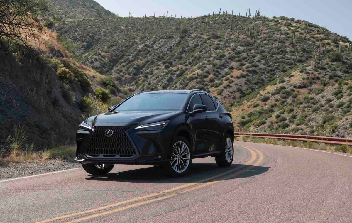 A dark grey 2022 Lexus NX 350 luxury SUV driving