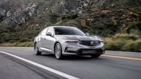 A silver 2023 Acura Integra driving