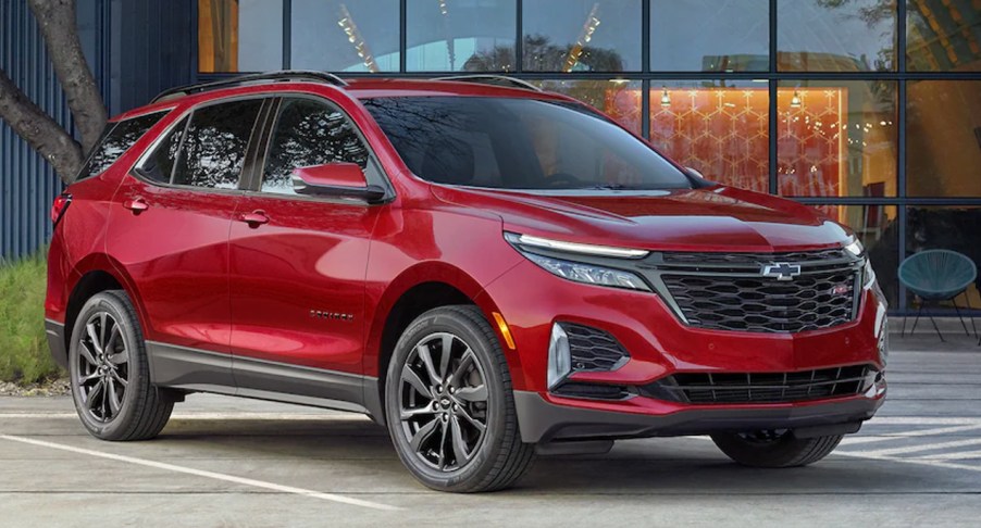 A red 2023 Chevrolet Equinox small SUV is parked.