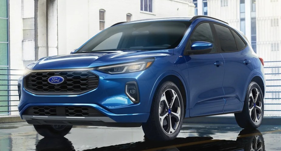 A blue 2023 Ford Escape ST-Line Elite is parked. 