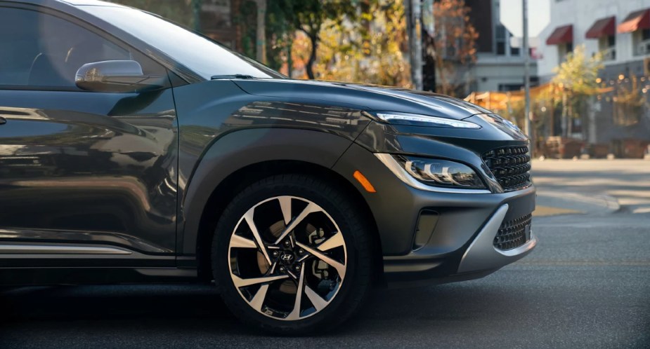 A black 2023 Hyundai Kona subcompact SUV is parked. 