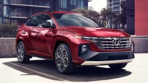 A red 2023 Hyundai Tucson small SJUV is parked.