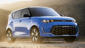 A blue 2023 Kia Soul subcompact SUV is parked.