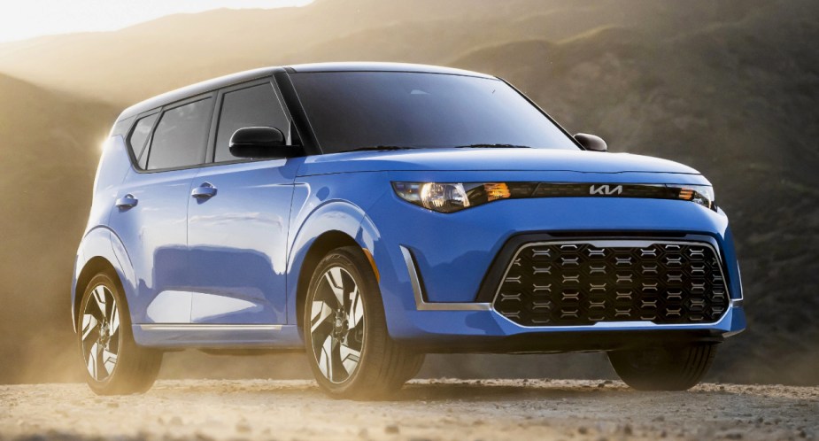 A blue 2023 Kia Soul subcompact SUV is parked.