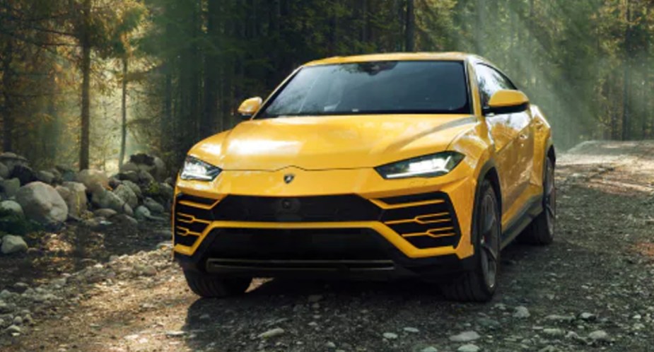 A yellow 2023 Lamborghini Urus luxury performance SUV is parked.