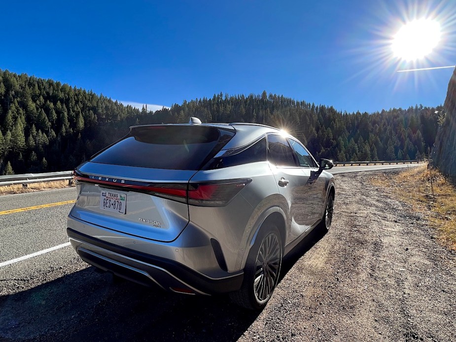 2023 Lexus RX 350h rear view on a mountain road