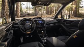 The interior and dashboard layout of a 2023 Subaru Forester compact crossover SUV