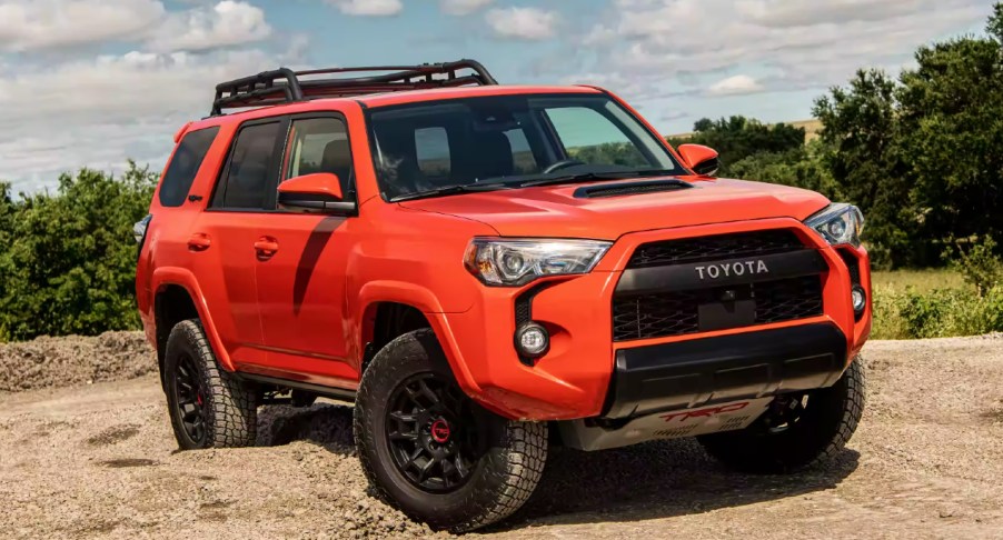 A red 2023 Toyota 4Runner midsize SUV is parked.