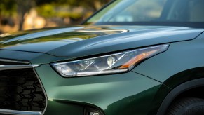 A green 2023 Toyota Highlander headlight, one of Toyota's vehicles that has the curve-speed management system.