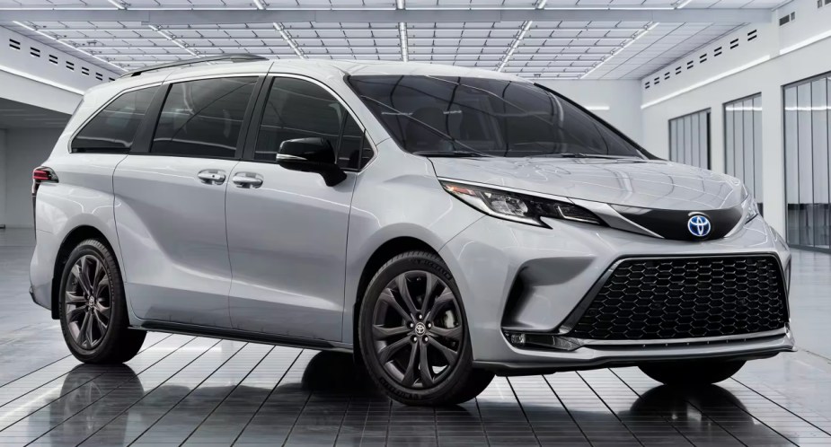 A gray 2023 Toyota Sienna minivan is parked.