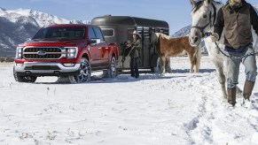 A red 2023 Ford F-150 King Ranch shows off as a luxury truck that can also do some work.