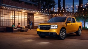 A 2023 Ford Maverick shows off its lighting as a small truck at night.