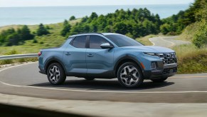 Hyundai's small truck, the 2023 Santa Cruz is cruising on the road.