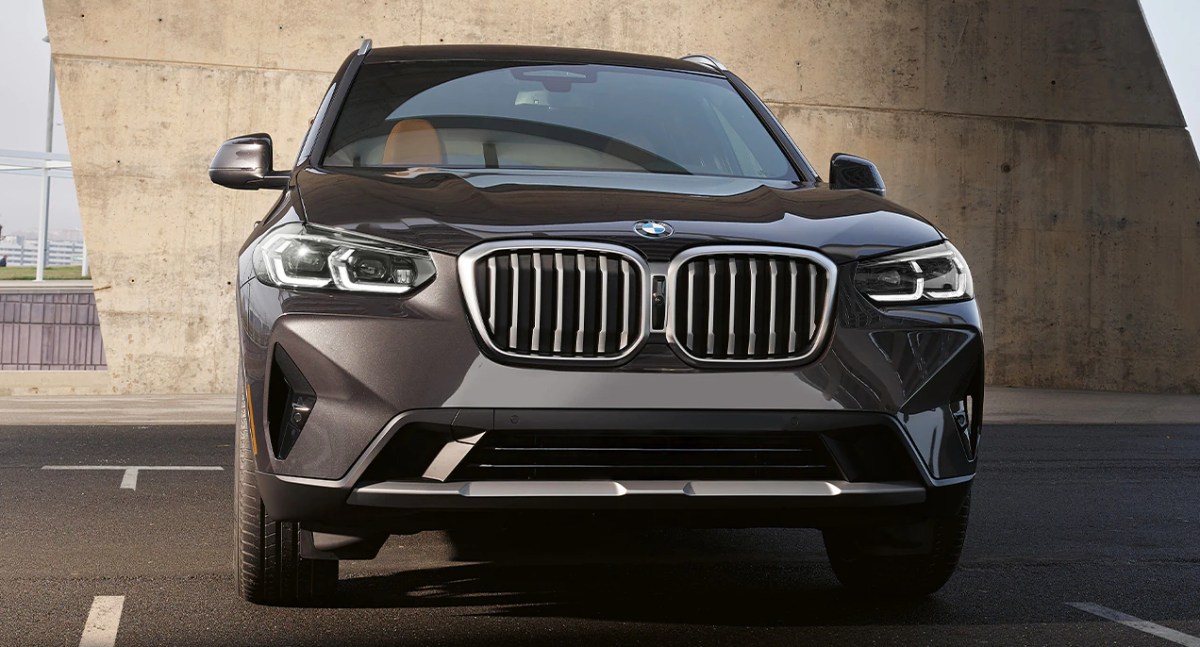 A gray 2023 BMW X3 small luxury SUV is parked.