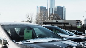 Car parked with a sale tag on the mirror, potentially a Black Friday car deal.