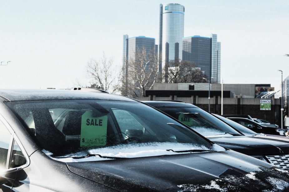 Car parked with a sale tag on the mirror, potentially a Black Friday car deal.