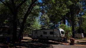 An RV parked on a lot, potentially for a person that went to buy an RV lot.