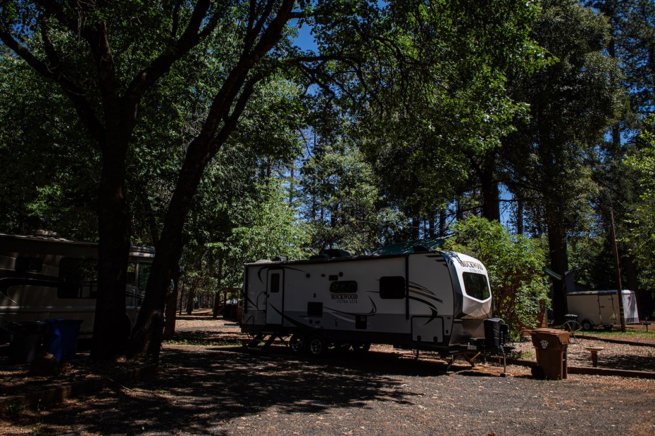 An RV parked on a lot, potentially for a person that went to buy an RV lot.