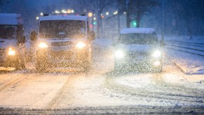 Cars driving in winter weather potentially concerned with EV driving range.