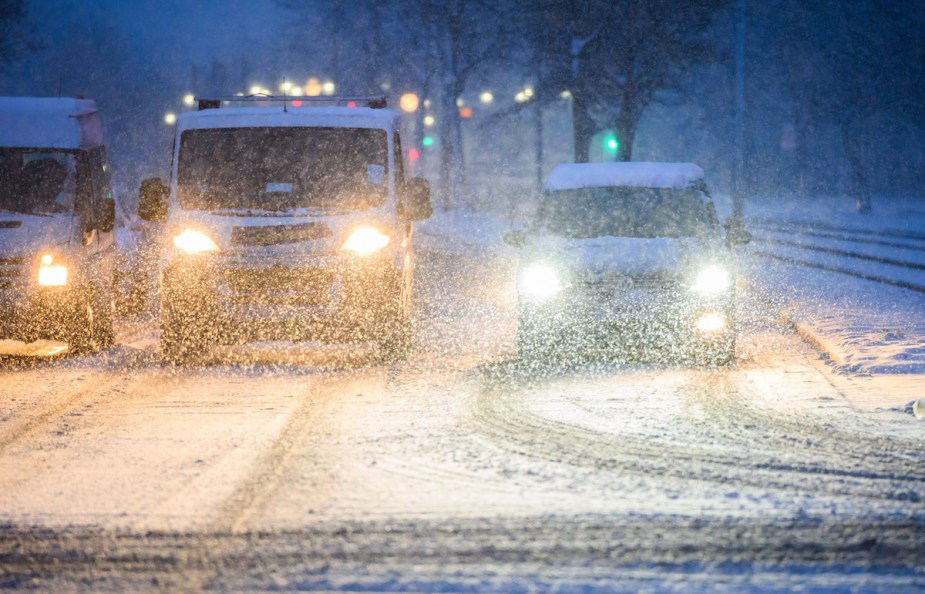 Cars driving in winter weather potentially concerned with EV driving range. 