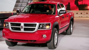 A red 2008 Dodge Dakota midsize pickup truck is parked.