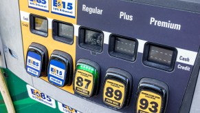 A gas pump displaying different grades of gasoline, including E15 gas.