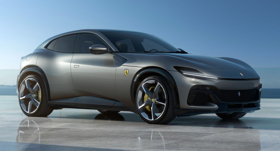 A gray 2023 Ferrari Purosangue luxury sports SUV is parked.