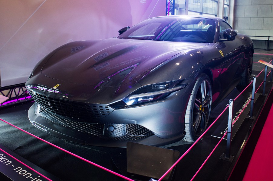 A Ferrari high performance car parked indoors.