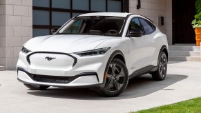 A white 2023 Ford Mustang Mach-E small electric SUV is parked.