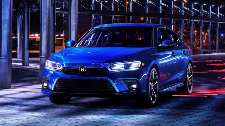 Front angle view of blue 2023 Honda Civic compact sedan