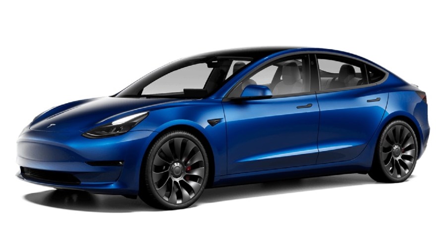 Front angle view of new 2023 Tesla Model 3 electric car with Deep Blue Metallic exterior paint color