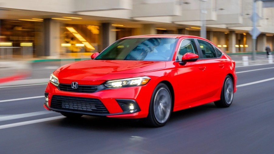 Front angle view of red 2023 Honda Civic, highlighting cheaper compact car alternatives that are not a Toyota Corolla