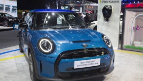 A blue EV parked indoors, as a terrible electric vehicle.