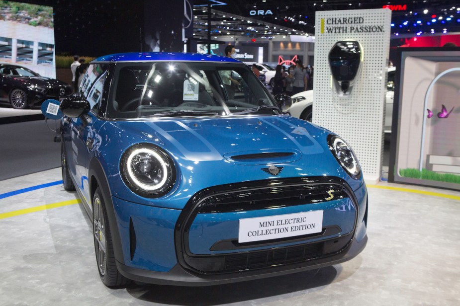 A blue EV parked indoors, as a terrible electric vehicle.