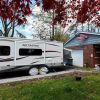 An RV parked in a home driveway in Nutley, New Jersey, which is an example of 'moochdocking'