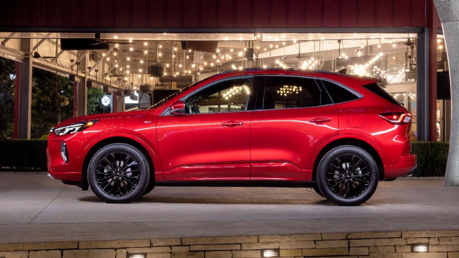 Side view of red 2023 Ford Escape, the cheapest new 2023 Ford SUV, costing under $30,000