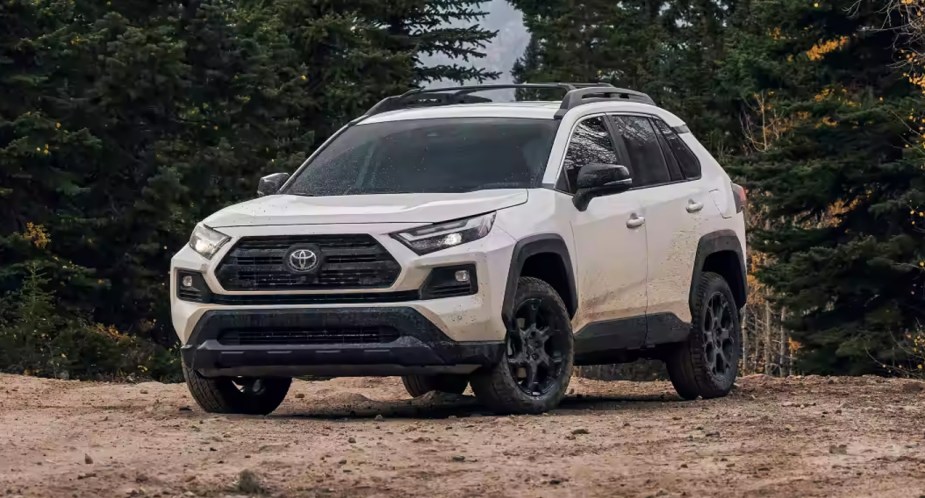 A white Toyota RAV4 TRD Off-Road is parked.