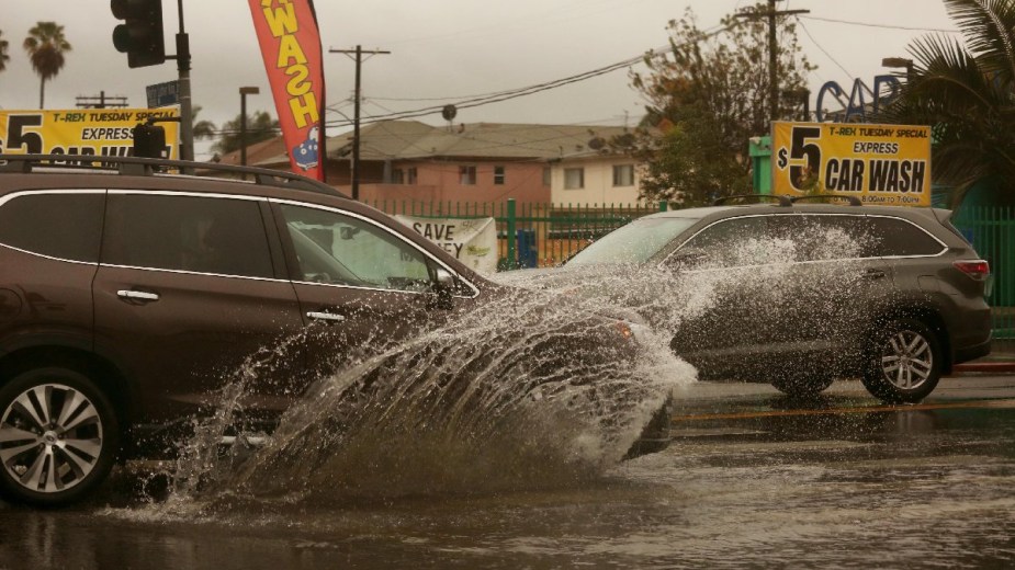 Vehicles driving by car wash, highlighting California car wash that cheated $800k from workers with $7 an hour wage