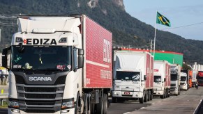 Trucks driving on the road driven by truckers, which used to pour alcohol in brake systems.