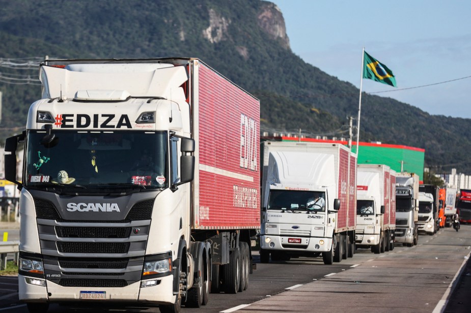 Trucks driving on the road driven by truckers, which used to pour alcohol in brake systems.