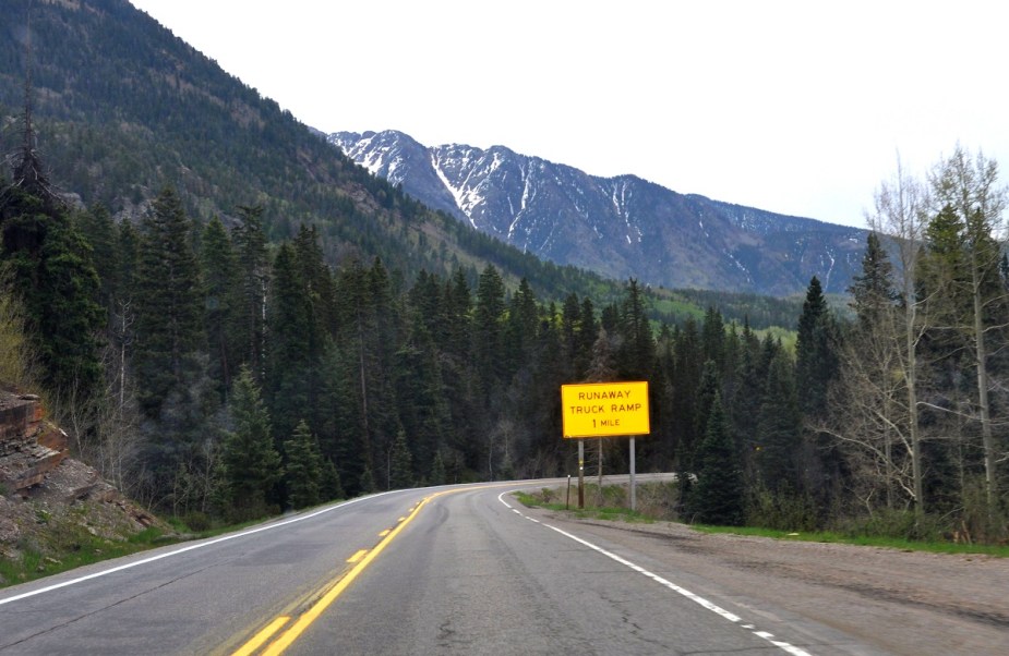 A highway sign shows the distance to the nearest runaway truck ramp.