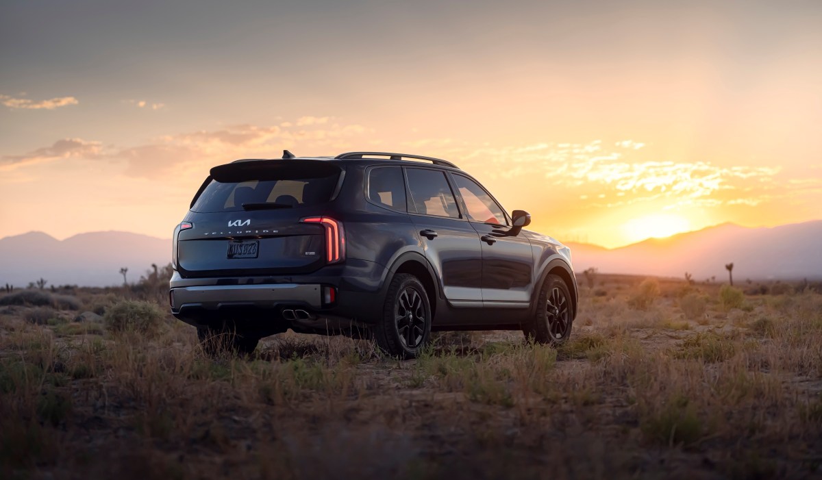 A black 2023 Kia Telluride parked in the desert.  