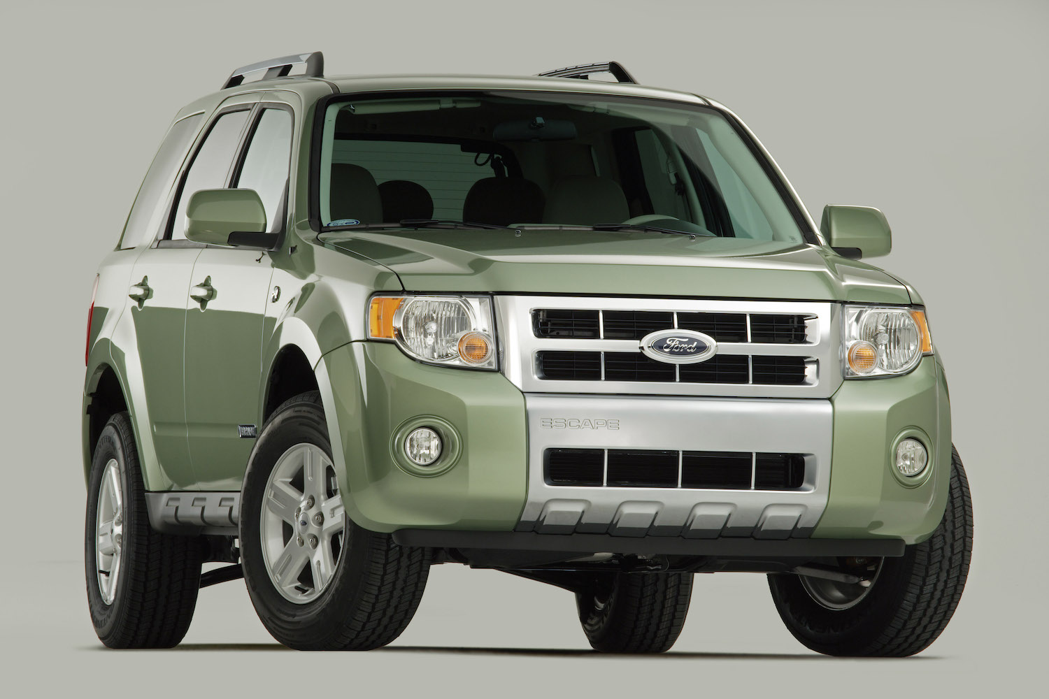 A promo photo of a light green 2008 Ford Escape SUV.