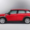 A red 2013 Mini Cooper Countryman subcompact luxury crossover SUV model