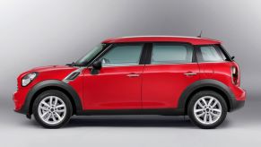 A red 2013 Mini Cooper Countryman subcompact luxury crossover SUV model