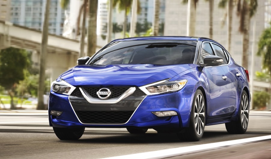 A blue 2016 Nissan Maxima parked