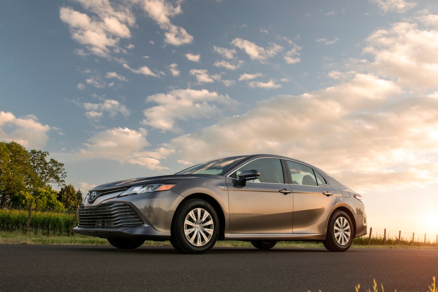 A 2020 Toyota Camry Hybrid car parked in the sun