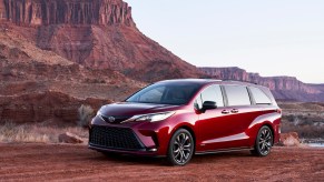 A red off-road Toyota Sienna parked outdoors.