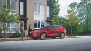 2022 Ford Escape Hybrid parked on the street in front of a building.